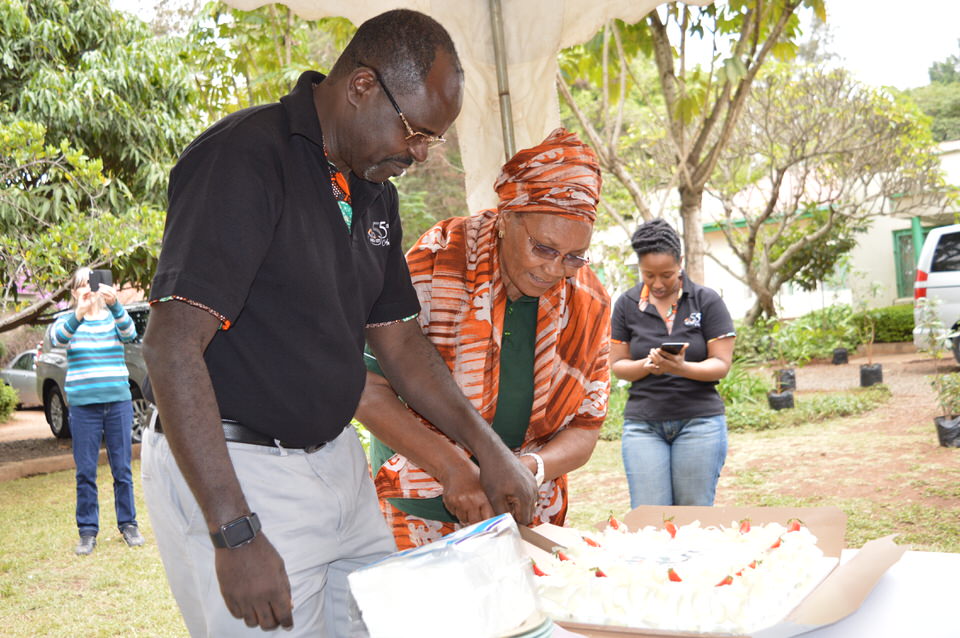 Our Chair-elect Mrs. Marion Kamau cuts the celebration cake alongside KBA CEO Mr. Habil Olaka