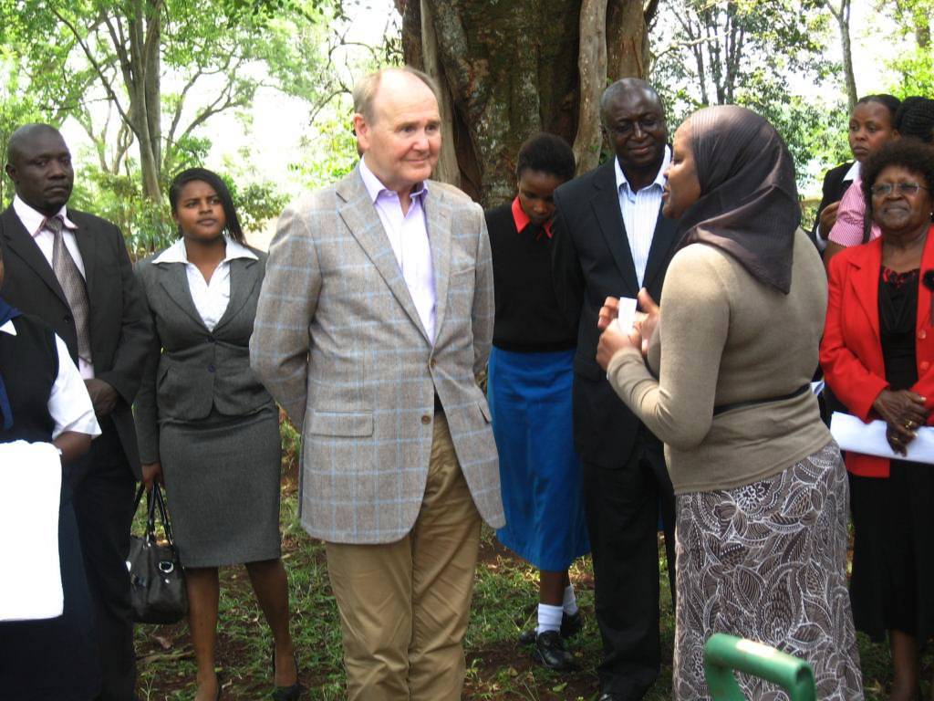 Ms. Aisha Karanja, Ag. Executive Director GBM giving a brief about the Green Belt Movement to Sir John Peace, Group Manager the Standard Chartered Bank