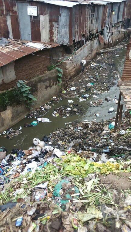 A section of Nairobi River passing through a slum